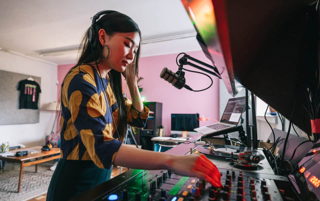 Woman standing at home music studio