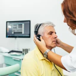 Man having his hearing tested at the audiologist